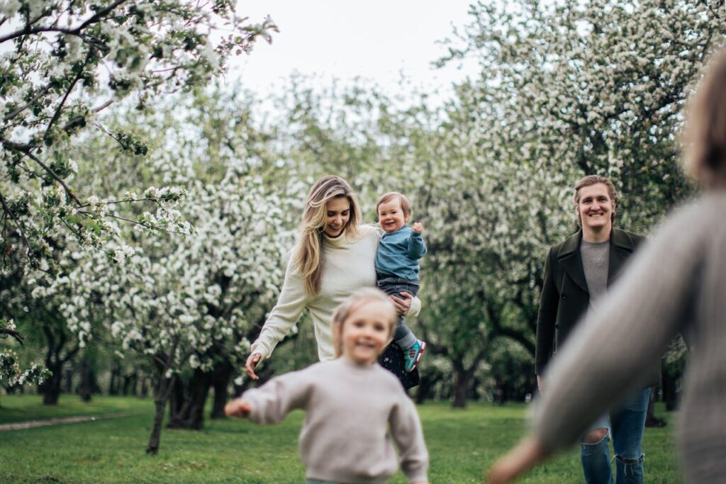happy family in park spending time to prevent the long-term psychological impact of divorce on children
